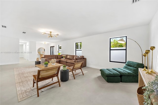 12505 SW 99th Ave, Miami, FL 33176 - living room featuring a chandelier and baseboards