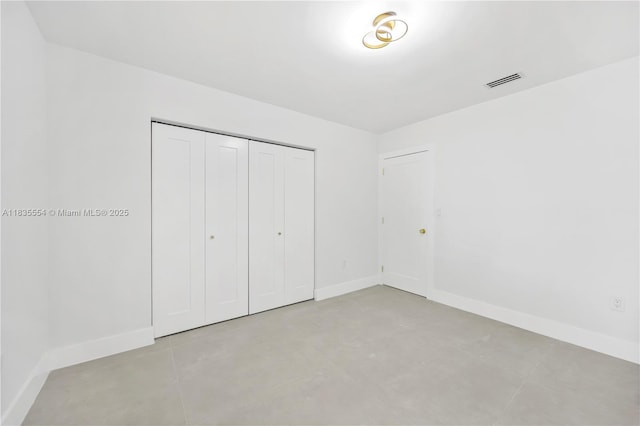 12505 SW 99th Ave, Miami, FL 33176 - unfurnished bedroom featuring a closet and concrete flooring