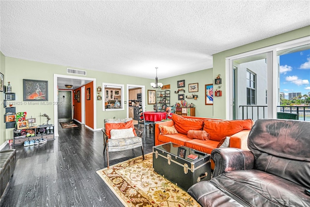 9341 E Bay Harbor Dr Unit 3D, Bay Harbor Islands, FL 33154 - living room with a chandelier, wood finished floors, and a textured ceiling