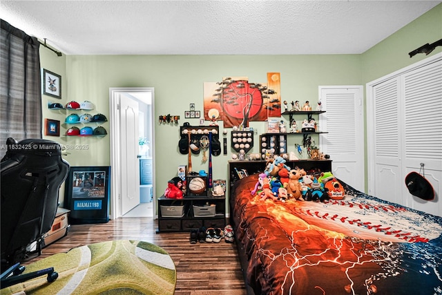 9341 E Bay Harbor Dr Unit 3D, Bay Harbor Islands, FL 33154 - bedroom with wood finished floors, a textured ceiling, and a closet