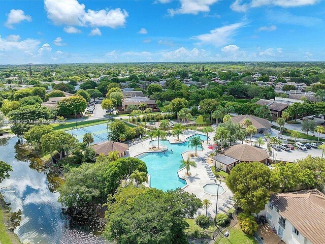 6455SW SW 116th Pl Unit C, Miami, FL 33173 - drone / aerial view of a pool area and a nearby body of water