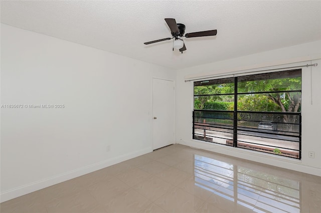 6455SW SW 116th Pl Unit C, Miami, FL 33173 - empty room with a ceiling fan and a textured ceiling