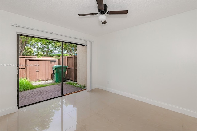 6455SW SW 116th Pl Unit C, Miami, FL 33173 - unfurnished room with a ceiling fan, tile patterned floors, and a textured ceiling