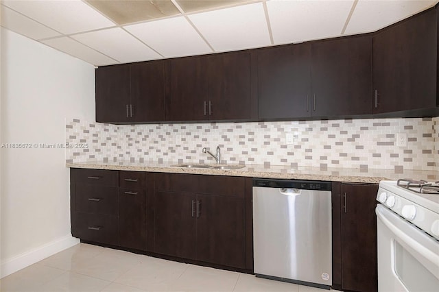 6455SW SW 116th Pl Unit C, Miami, FL 33173 - kitchen with dishwasher, white gas range, backsplash, dark brown cabinets, and light stone counters