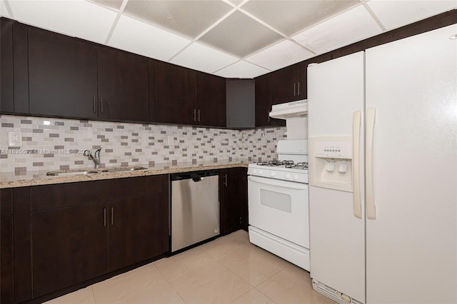 6455SW SW 116th Pl Unit C, Miami, FL 33173 - kitchen featuring white appliances, under cabinet range hood, tasteful backsplash, dark brown cabinets, and a drop ceiling