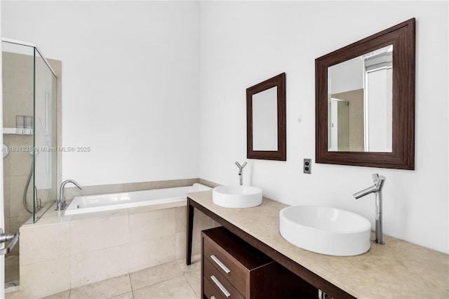 495 SE Brickell Ave Unit 1511, Miami, FL 33131 - bathroom featuring a garden tub, a shower stall, double vanity, and tile patterned flooring