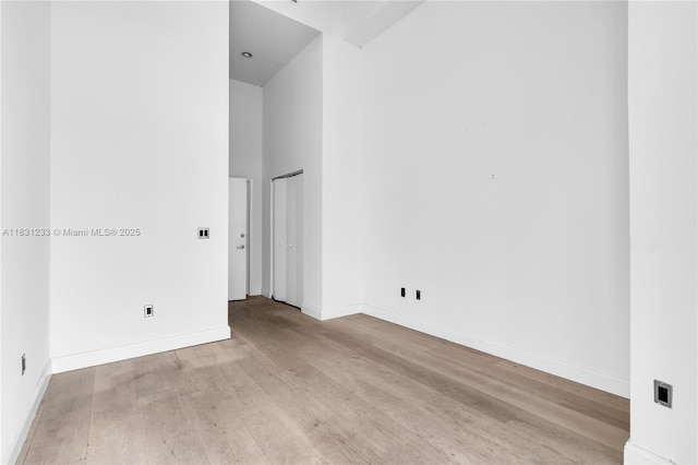 495 SE Brickell Ave Unit 1511, Miami, FL 33131 - empty room with wood finished floors and a towering ceiling