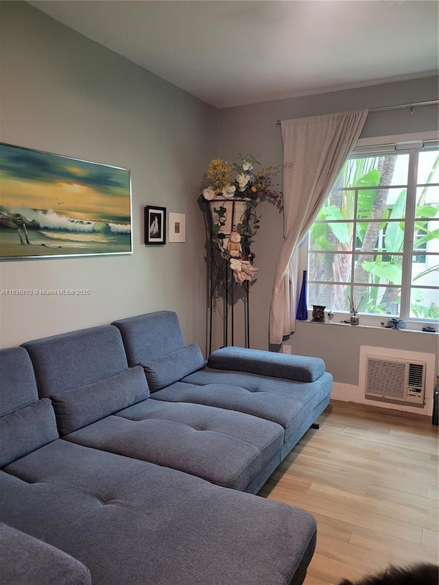 349 Meridian Ave Unit B103, Miami Beach, FL 33139 - living room with light wood-style floors and an AC wall unit