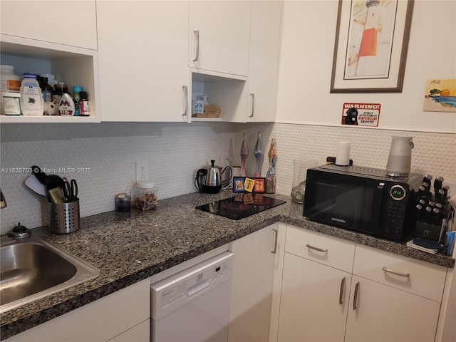 349 Meridian Ave Unit B103, Miami Beach, FL 33139 - kitchen with open shelves, black appliances, white cabinetry, and backsplash