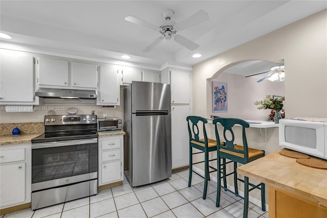 2420 Deer Creek Country Club Blvd Unit 203-D, Deerfield Beach, FL 33442 - kitchen with appliances with stainless steel finishes, ceiling fan, under cabinet range hood, recessed lighting, and light countertops