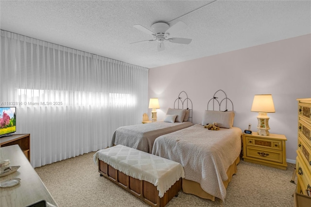 2420 Deer Creek Country Club Blvd Unit 203-D, Deerfield Beach, FL 33442 - bedroom with carpet, a textured ceiling, and ceiling fan