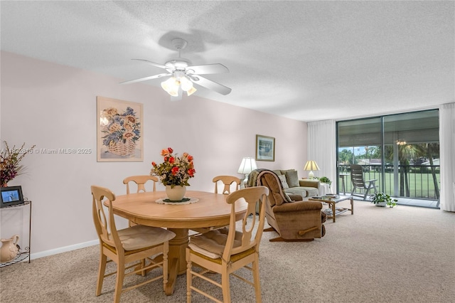 2420 Deer Creek Country Club Blvd Unit 203-D, Deerfield Beach, FL 33442 - dining room featuring carpet, a textured ceiling, and ceiling fan