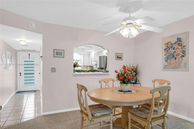 2420 Deer Creek Country Club Blvd Unit 203-D, Deerfield Beach, FL 33442 - dining room featuring a ceiling fan and arched walkways