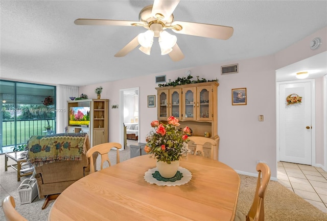 2420 Deer Creek Country Club Blvd Unit 203-D, Deerfield Beach, FL 33442 - dining room with light tile patterned floors, ceiling fan, a textured ceiling, and light carpet