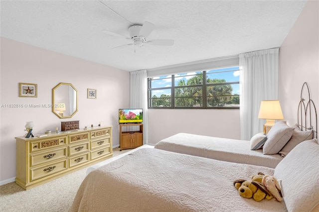 2420 Deer Creek Country Club Blvd Unit 203-D, Deerfield Beach, FL 33442 - bedroom with light carpet and a ceiling fan