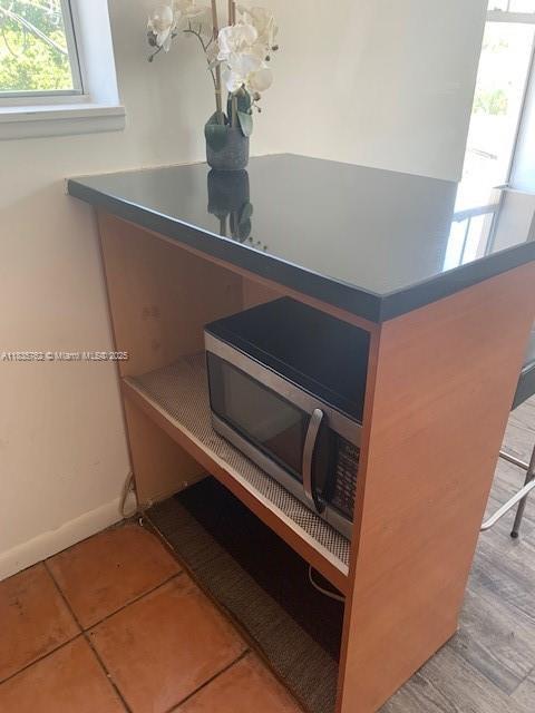 1244 Pennsylvania Ave Unit 306, Miami Beach, FL 33139 - detailed view of stainless steel microwave and baseboards