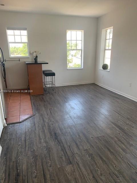 1244 Pennsylvania Ave Unit 306, Miami Beach, FL 33139 - unfurnished room featuring healthy amount of natural light and dark wood finished floors