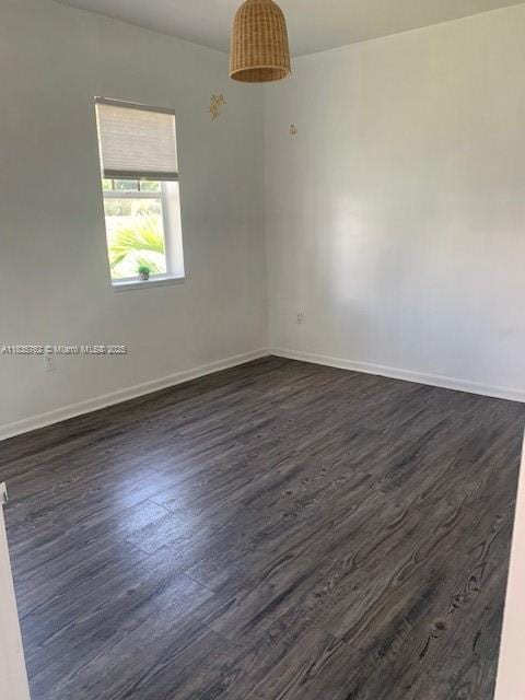1244 Pennsylvania Ave Unit 306, Miami Beach, FL 33139 - empty room featuring dark wood-style floors and baseboards