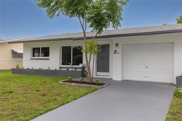 4516 Mainland Dr, Tamarac, FL 33319 - single story home featuring an attached garage, a front yard, stucco siding, and driveway