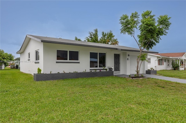 4516 Mainland Dr, Tamarac, FL 33319 - single story home with an attached garage, stucco siding, and a front yard