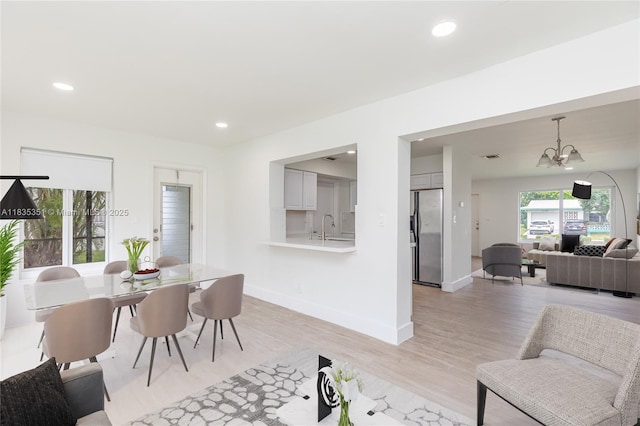 4516 Mainland Dr, Tamarac, FL 33319 - dining area featuring light wood-type flooring, a chandelier, and recessed lighting