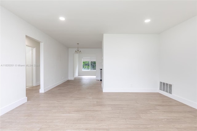 4516 Mainland Dr, Tamarac, FL 33319 - spare room with light wood finished floors, recessed lighting, and a chandelier
