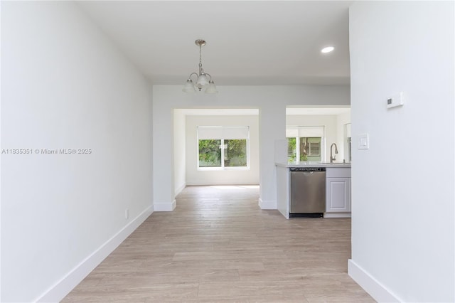 4516 Mainland Dr, Tamarac, FL 33319 - hallway with a chandelier, light wood-style floors, and recessed lighting