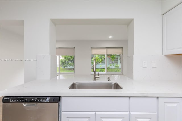 4516 Mainland Dr, Tamarac, FL 33319 - kitchen with stainless steel dishwasher, white cabinetry, light stone counters, and recessed lighting
