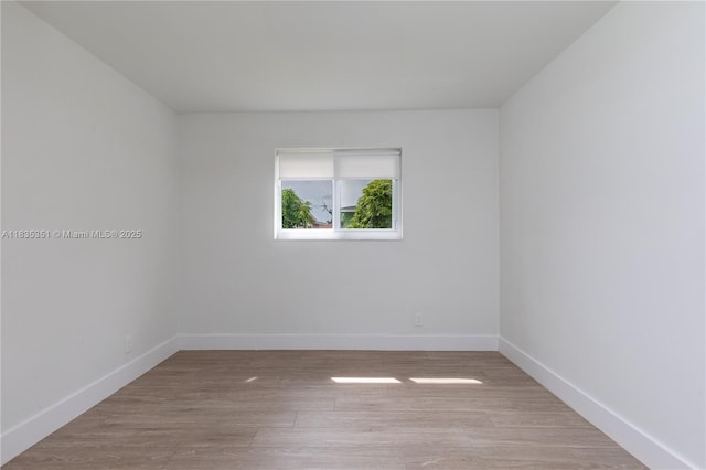 4516 Mainland Dr, Tamarac, FL 33319 - empty room featuring baseboards and wood finished floors