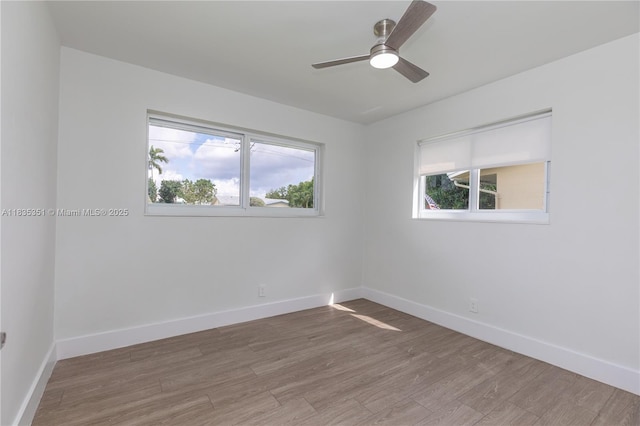 4516 Mainland Dr, Tamarac, FL 33319 - spare room featuring healthy amount of natural light, wood finished floors, and ceiling fan