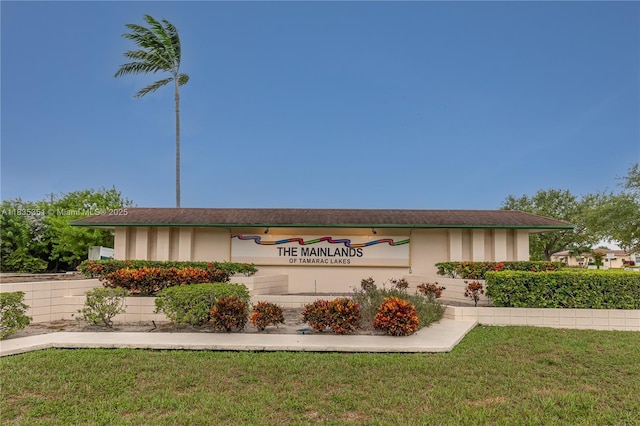 4516 Mainland Dr, Tamarac, FL 33319 - community / neighborhood sign featuring a lawn