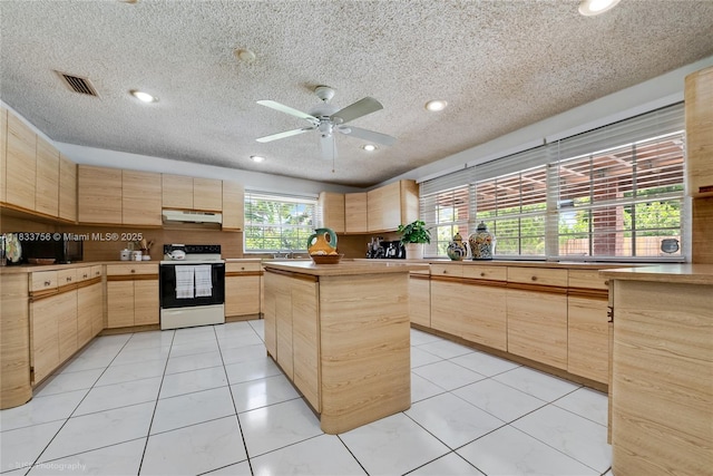 4235 SW 97th Ave, Miami, FL 33165 - kitchen featuring white range with electric cooktop, light brown cabinets, under cabinet range hood, a textured ceiling, and recessed lighting