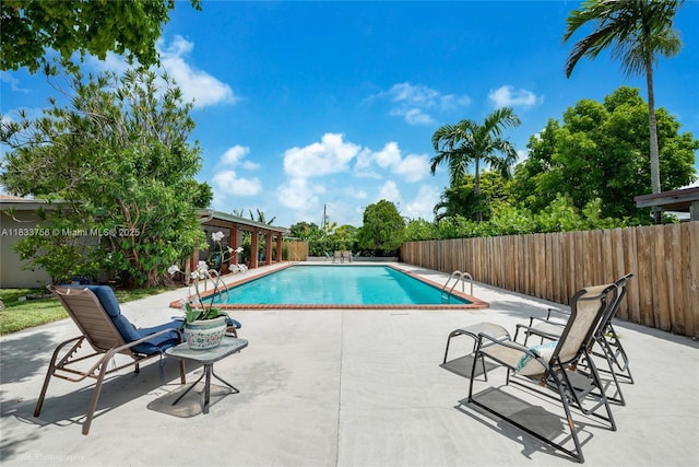 4235 SW 97th Ave, Miami, FL 33165 - view of swimming pool featuring a patio area