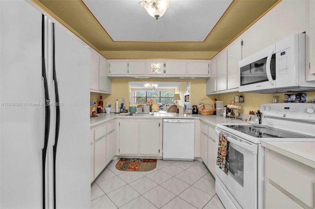 10400 NW 30th Ct Unit 305, Sunrise, FL 33322 - kitchen with white appliances, light countertops, and a chandelier