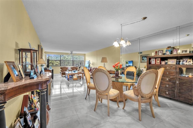 10400 NW 30th Ct Unit 305, Sunrise, FL 33322 - dining space featuring a textured ceiling and a chandelier