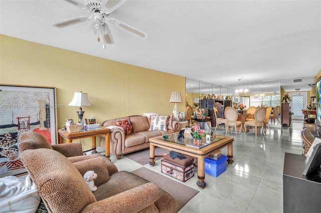 10400 NW 30th Ct Unit 305, Sunrise, FL 33322 - living area with ceiling fan, tile patterned floors, and a textured ceiling