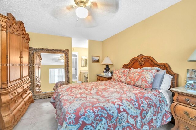 10400 NW 30th Ct Unit 305, Sunrise, FL 33322 - bedroom featuring a ceiling fan, ensuite bath, and a textured ceiling