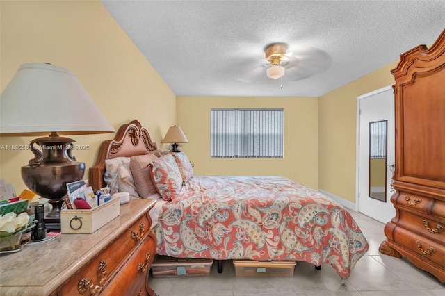 10400 NW 30th Ct Unit 305, Sunrise, FL 33322 - bedroom featuring a textured ceiling, a ceiling fan, and light tile patterned flooring