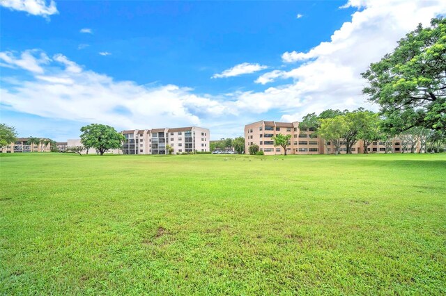 10400 NW 30th Ct Unit 305, Sunrise, FL 33322 - view of home's community with a yard