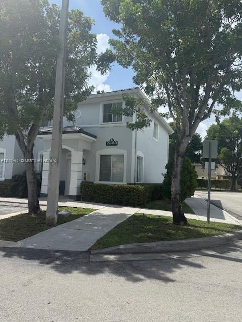 7325NW 174th Te # 104, Miami Lakes, FL 33015 - view of front of home featuring stucco siding