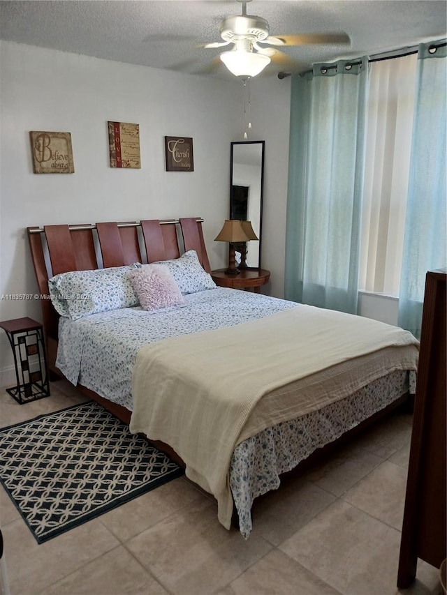 3750 Inverrary Dr Unit 1Z, Lauderhill, FL 33319 - tiled bedroom featuring a textured ceiling and a ceiling fan