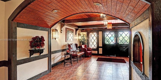 3750 Inverrary Dr Unit 1Z, Lauderhill, FL 33319 - entryway with wood ceiling and arched walkways