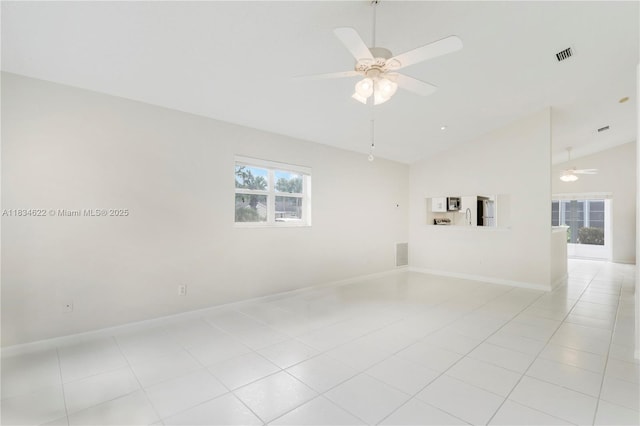 653 NW San Remo Cir, Port St Lucie, FL 34986 - empty room featuring a ceiling fan and high vaulted ceiling