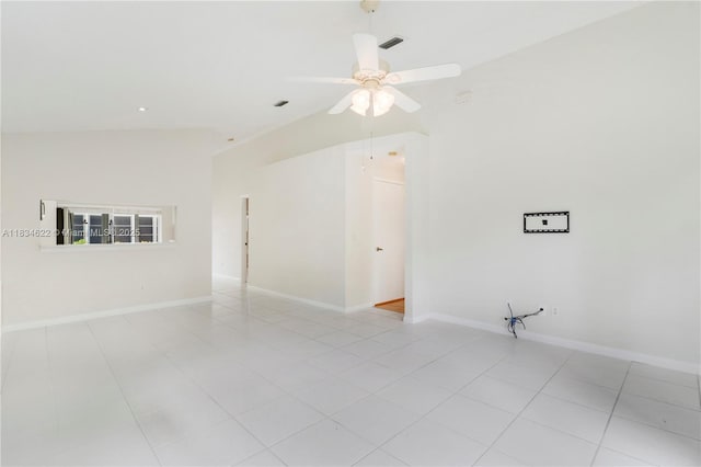 653 NW San Remo Cir, Port St Lucie, FL 34986 - empty room featuring a ceiling fan, vaulted ceiling, and light tile patterned floors