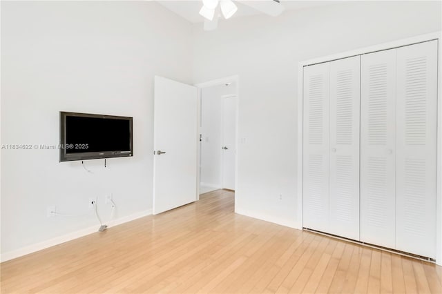 653 NW San Remo Cir, Port St Lucie, FL 34986 - unfurnished bedroom with wood finished floors, a closet, and ceiling fan