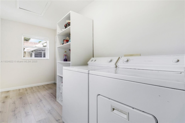 653 NW San Remo Cir, Port St Lucie, FL 34986 - washroom with light wood finished floors, washer and dryer, and attic access