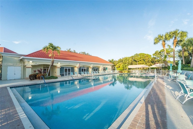 653 NW San Remo Cir, Port St Lucie, FL 34986 - community pool featuring a patio