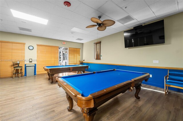 653 NW San Remo Cir, Port St Lucie, FL 34986 - recreation room featuring wood finished floors, a paneled ceiling, pool table, and ceiling fan