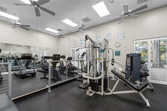 653 NW San Remo Cir, Port St Lucie, FL 34986 - exercise room with ceiling fan, a towering ceiling, and a drop ceiling