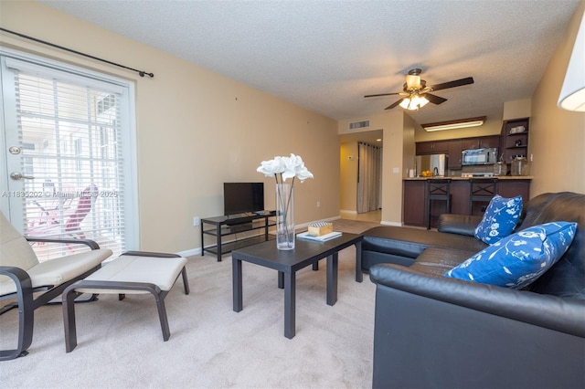 1280 S Alhambra Cir Unit 1310, Coral Gables, FL 33146 - living area featuring light colored carpet, ceiling fan, and a textured ceiling